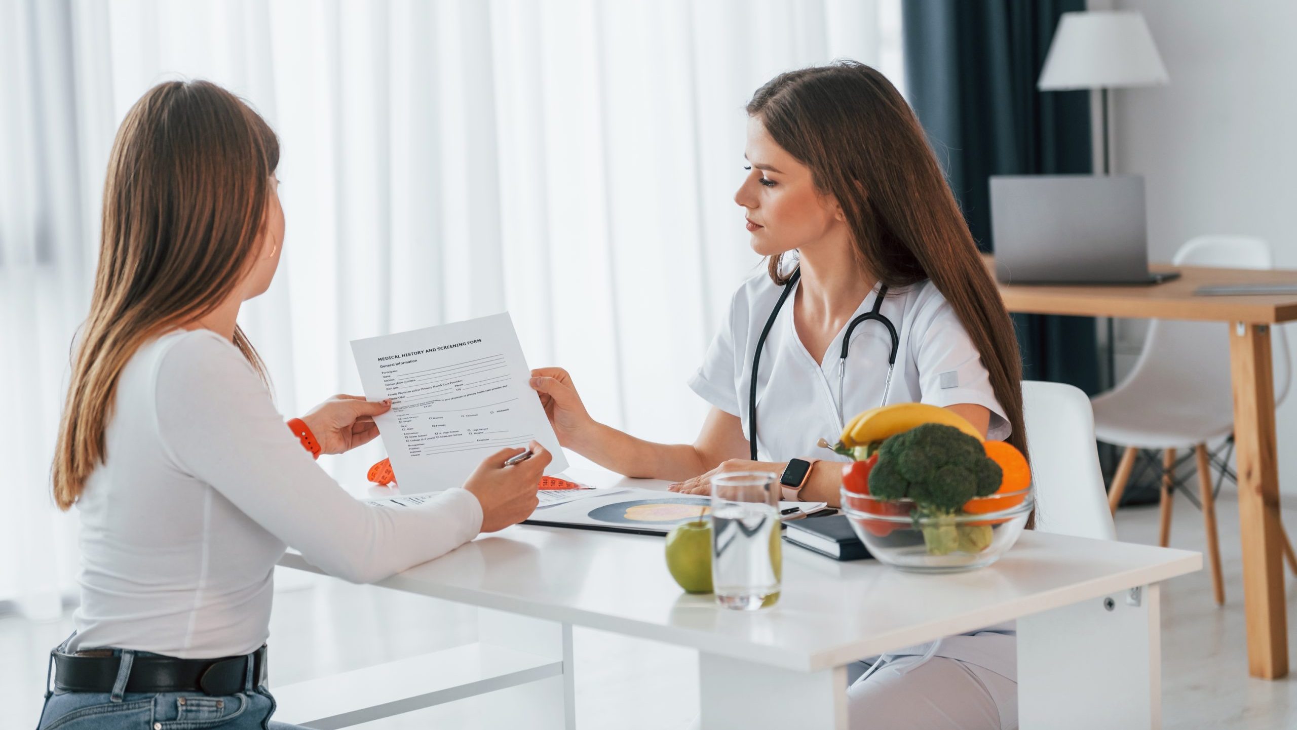 Female,Visitor,Is,Sitting,With,Doctor.,Professional,Medical,Worker,In