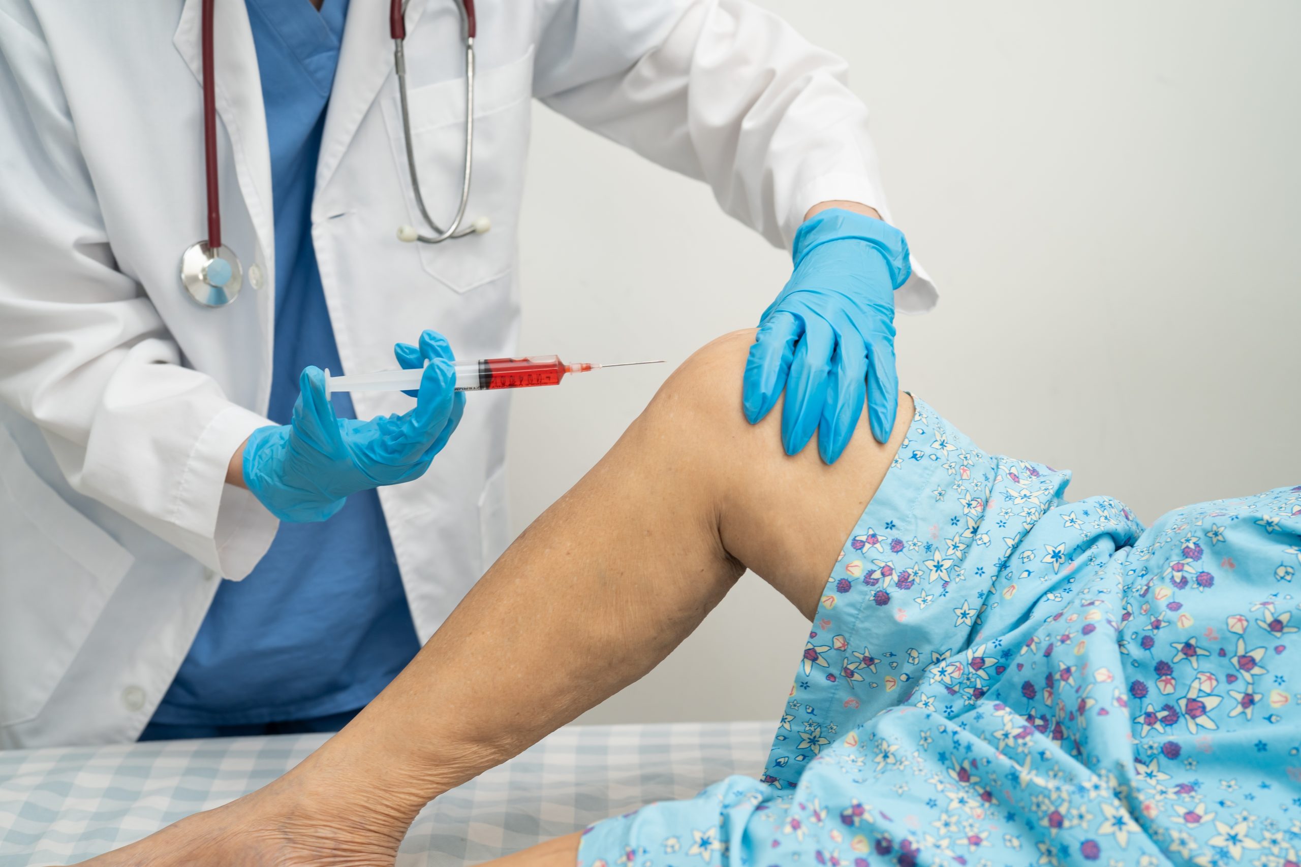 Hyaluronic acid injection for knee pain and knee osteoarthritis treatment performed by a healthcare professional
