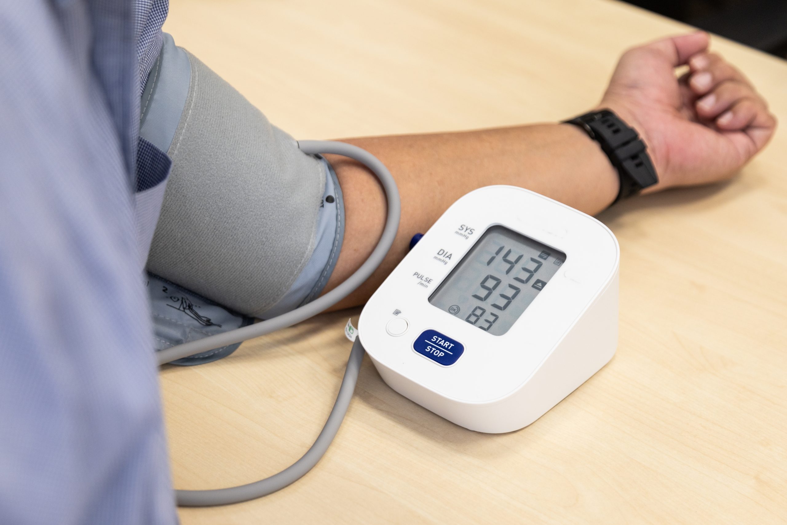 Digital blood pressure monitor measuring blood pressure during a health screening at Evercare Medical Care Centre in Penang.