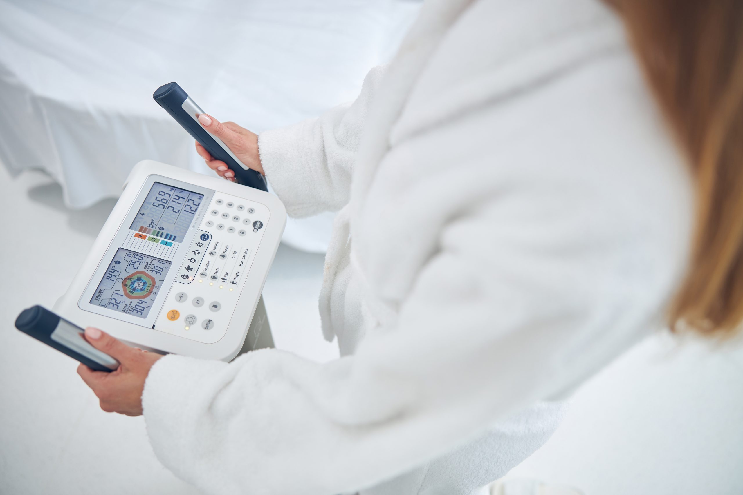 Patient undergoing a body composition analysis at Evercare Medical Care Centre in Penang to measure body fat, muscle mass, visceral fat and overall health.