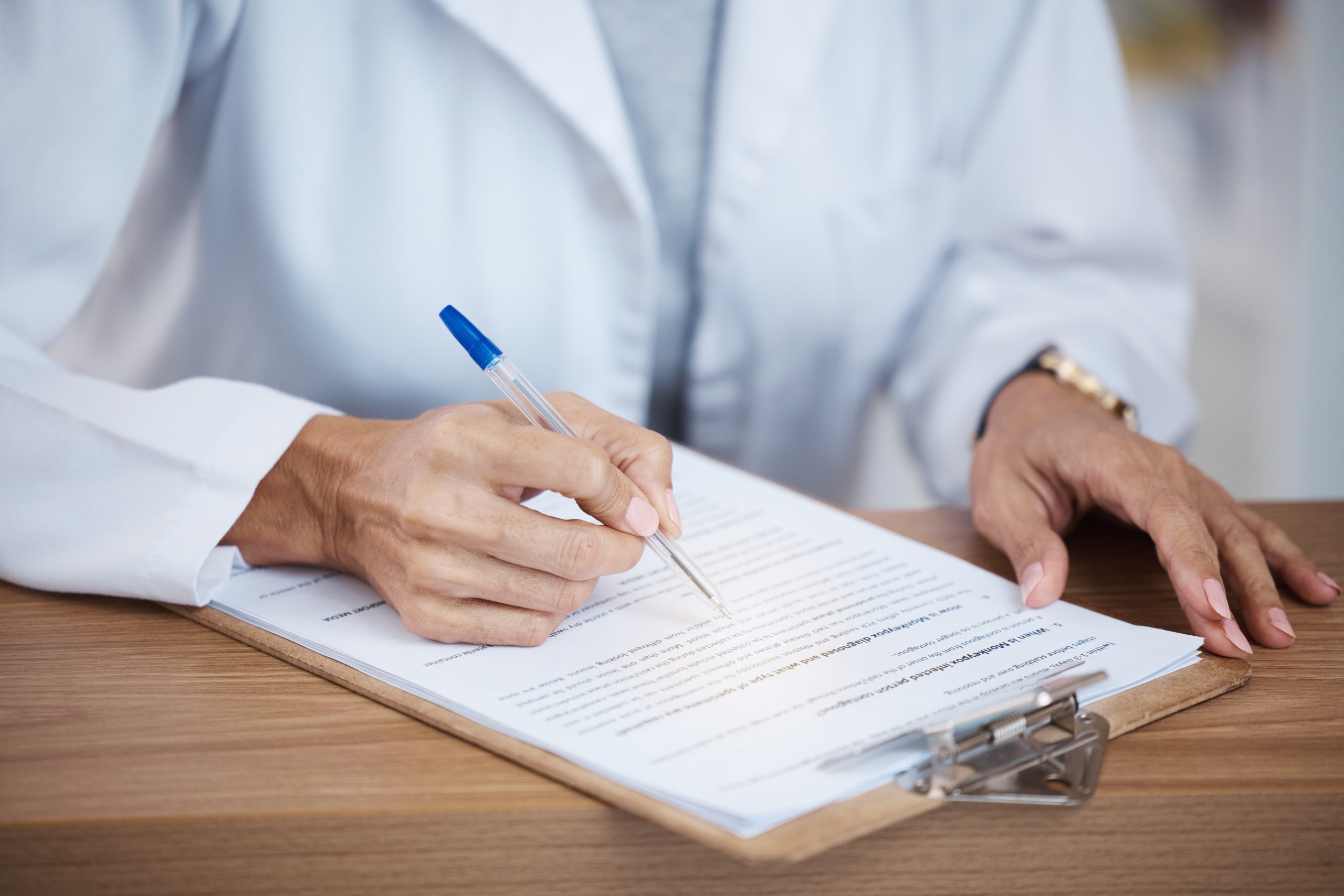Doctor reviewing and preparing a medical report after a comprehensive health screening at Evercare Medical Care Centre in Penang.