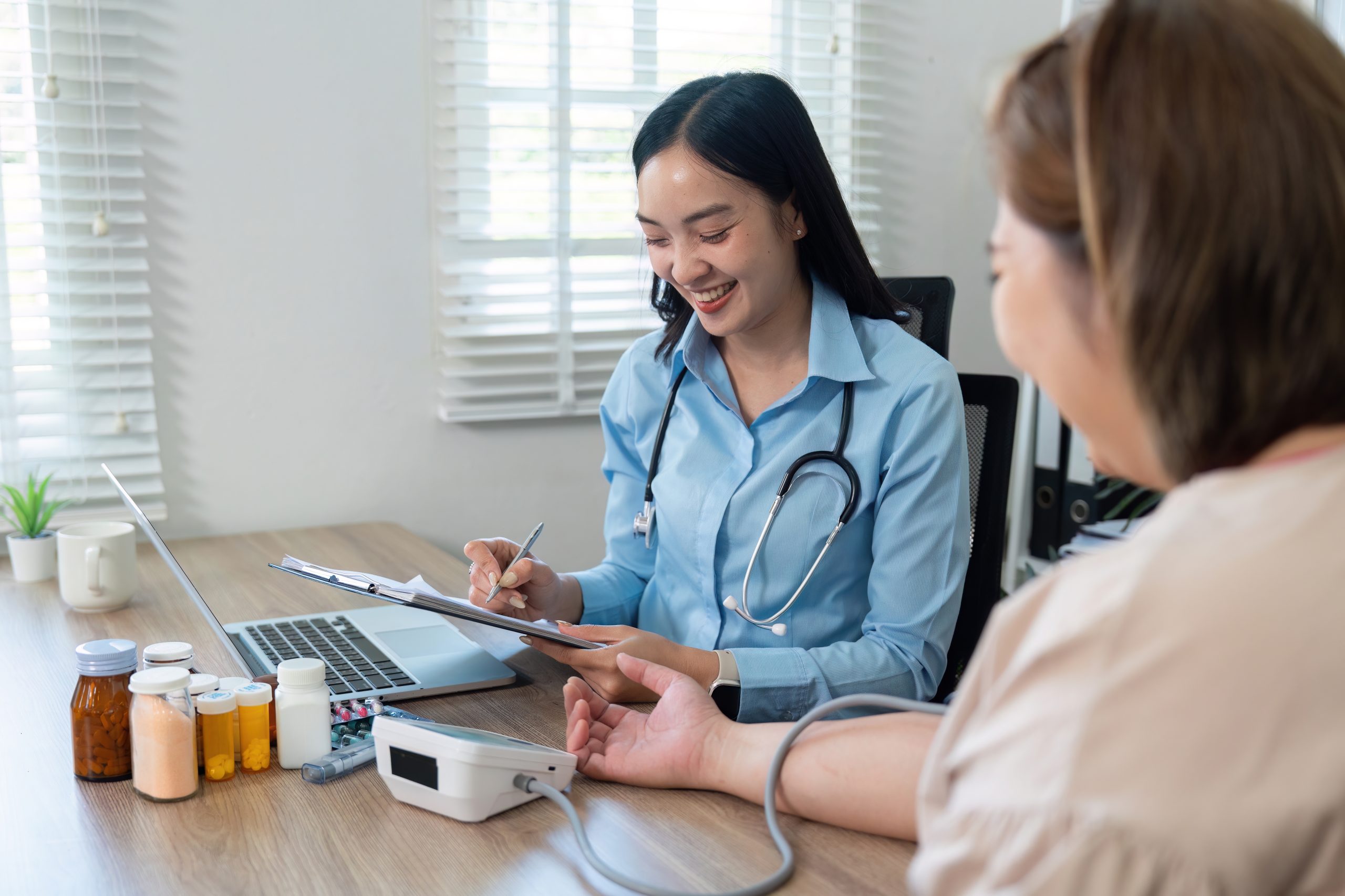 Doctor conducting a personalised medical consultation and health assessment with a patient at Evercare Medical Care Centre in Penang.