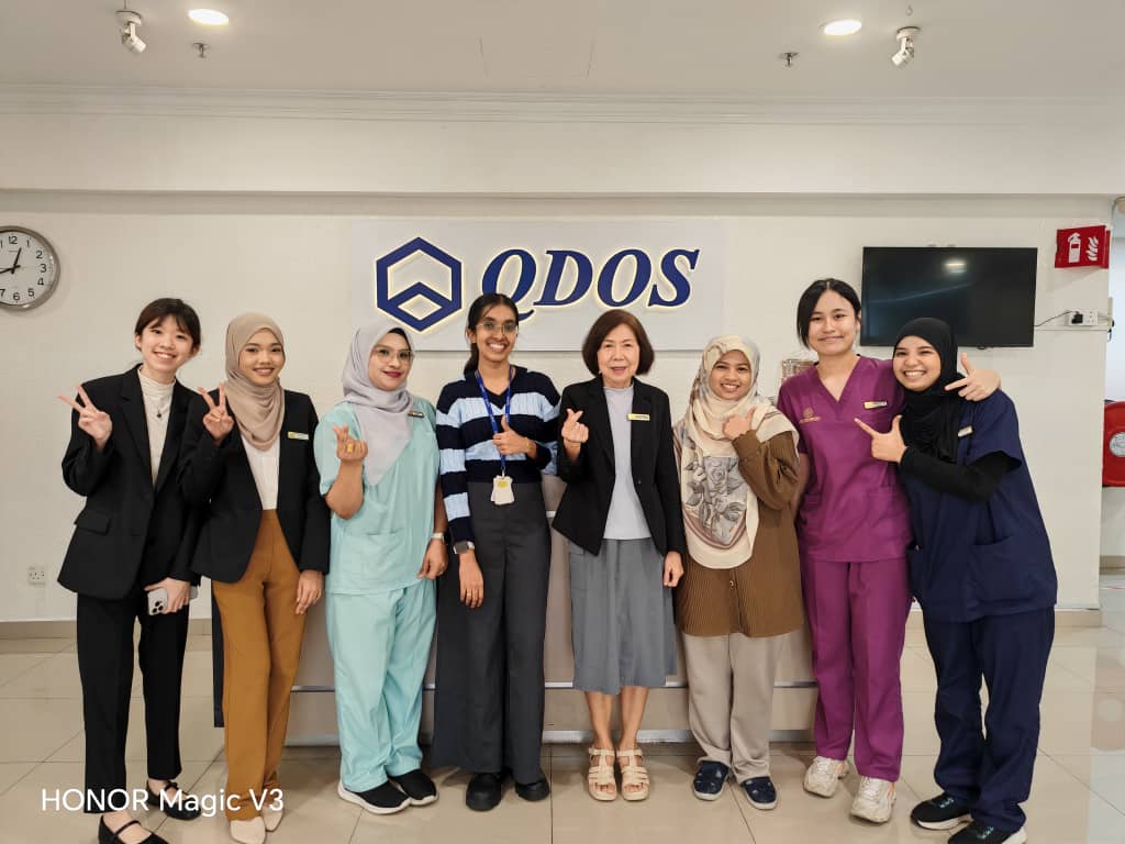 Evercare Medical Care Centre healthcare team posing with Qdos Bayan Lepas staff during a corporate workplace health screening programme in Penang.