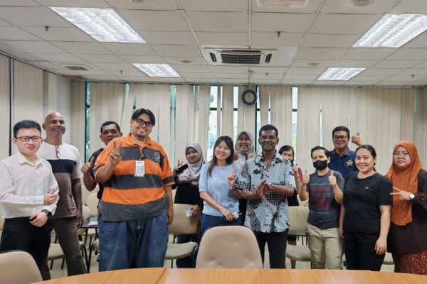 Dr. Balavendrian Anthony posing with employees after a corporate health talk at ISO Technologies Sdn. Bhd. in Penang.