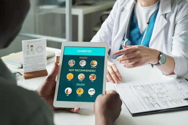 Middle,Aged,Black,Man,Holding,Digital,Tablet,Displaying,Diabetes,Diet